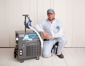 osha-2 A man kneeling down next to an air conditioner.