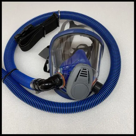 A blue colored full faced respirator mask with breathing tube